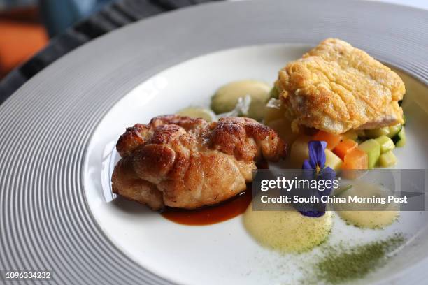 This image shows veal sweetbread and veal piccata with vegetables..., News Photo