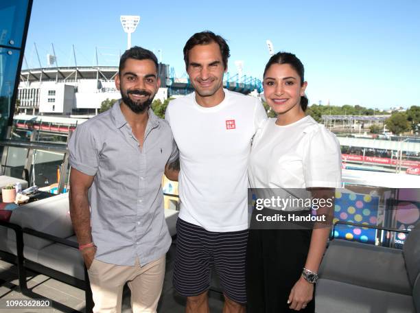 In this handout image provded by Tennis Australia, Virat Kohli and wife Anushka Sharma meet with Roger Federer of Switzerland during the 2019...