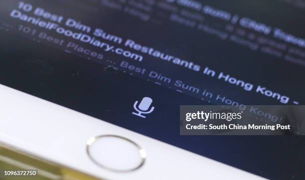 This image shows a detail of iPhone 7 smartphone screen showing Siri voice control button. 27OCT16 SCMP/May Tse [31OCTOBER2016 FEATURES DIGITAL]