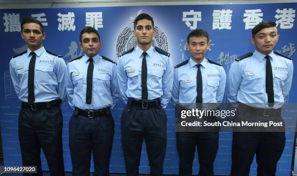 Non-ethnic Chinese police officers Singh Gimandeep, Singh Gagandeep, Ifzal Zaffar, Gurung Niraj and Escuro Dean Jason Olino pose for a photograph as...