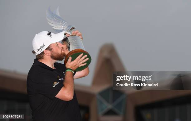 Shane Lowry of Ireland celebrates with the winners trophy after the final round of the Abu Dhabi HSBC Golf Championship at Abu Dhabi Golf Club on...