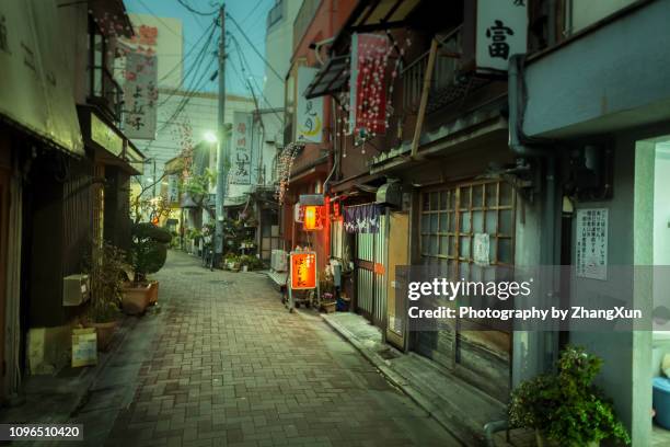 city street of tokyo monzennakatyou at twilight, tokyo, japan. - japan street stock pictures, royalty-free photos & images