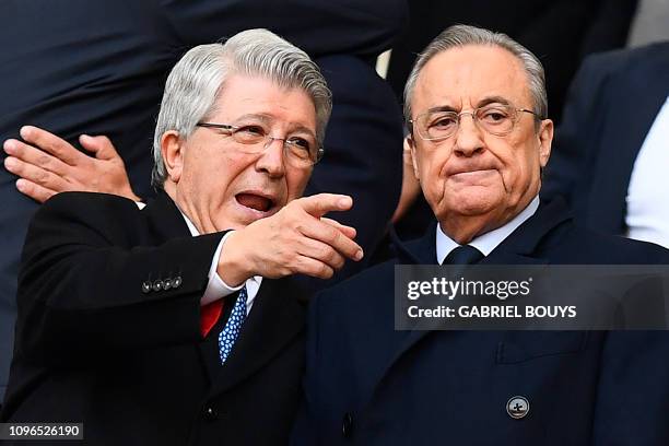 Atletico Madrid's Spanish president Enrique Cerezo speaks to Real Madrid's Spanish president Florentino Perez before the Spanish league football...