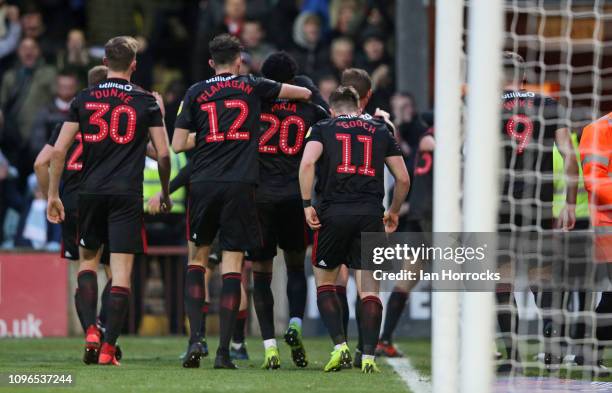Sunderland players celebrate the opening goal during the Sky Bet League One match between Scunthorpe United and Sunderland at Glanford Park on...