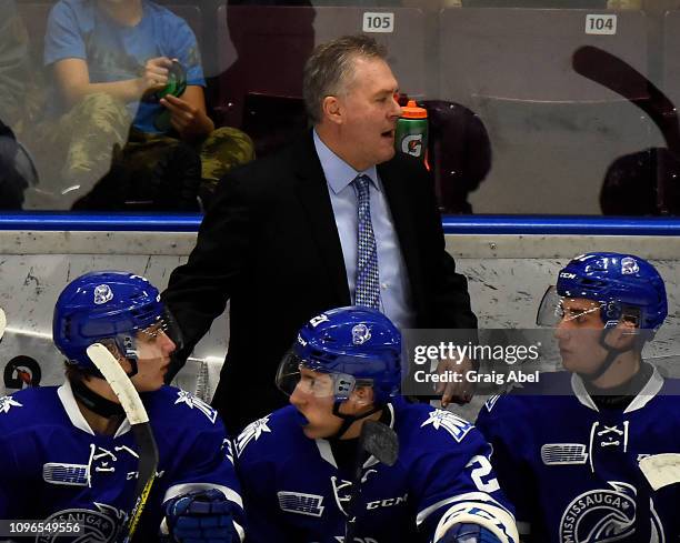 Head coach James Richmond of the Mississauga Steelheads hands out instructions against the Flint Firebirds during OHL game action on January 18, 2019...