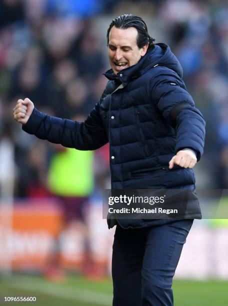 Unai Emery, Manager of Arsenal celebrates after his team's second goal during the Premier League match between Huddersfield Town and Arsenal FC at...