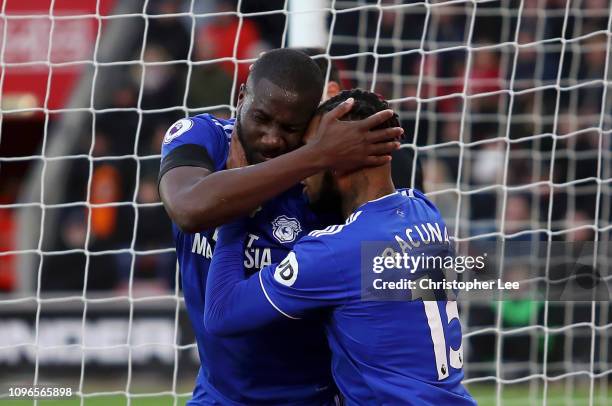 Sol Bamba of Cardiff City celebrates with teammate Leandro Bacuna after scoring his team's first goal during the Premier League match between...