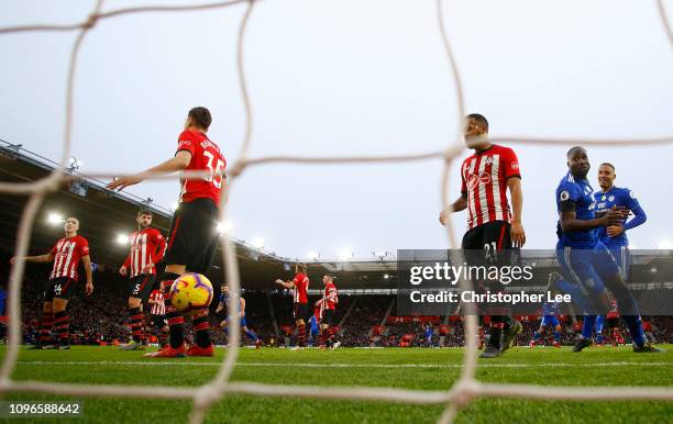 Sol Bamba of Cardiff City celebrates after scoring his team's first goal as Ryan Bertrand of Southampton reacts during the Premier League match...