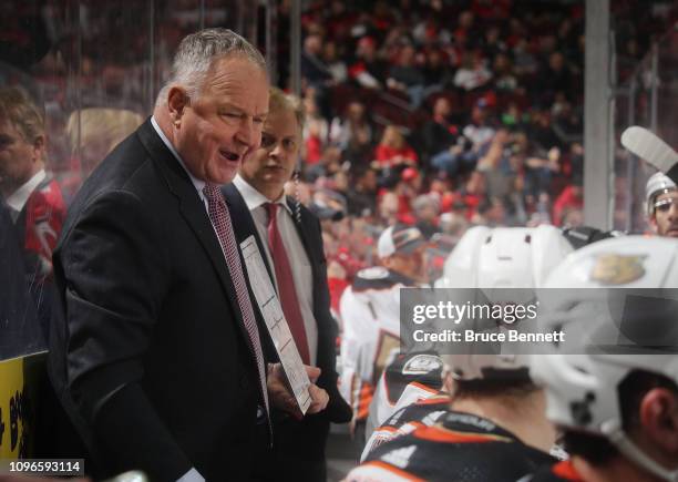 Randy Carlyle of the Anaheim Ducks handles bench duties during the first period against the New Jersey Devils at the Prudential Center on January 19,...