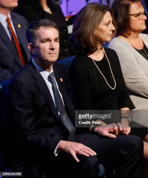 Virginia Gov. Ralph Northam, left, and his wife Pam, wait for the start of the funeral for fallen Virginia State Trooper Lucas B. Dowell at the...