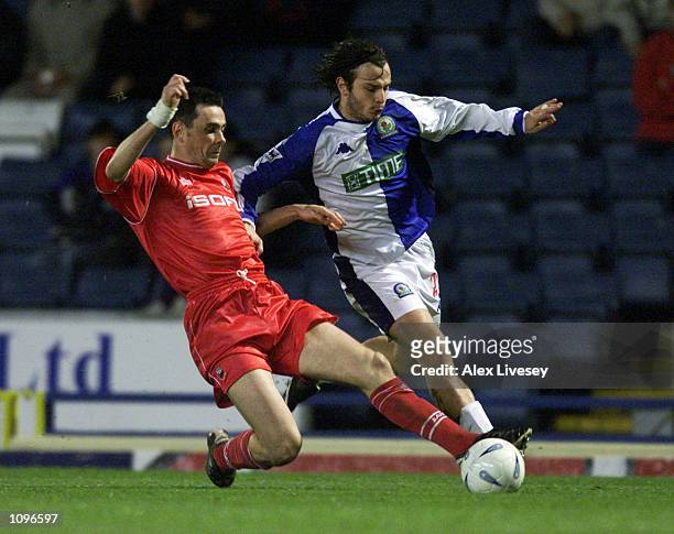 Corrado Grabbi of Blackburn Rovers takes the ball past Steve Chettle of Barnsley during the AXA sponsored FA Cup third round replay match played at...