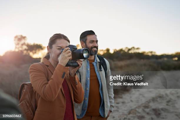 couple taking pictures on safari trip - digital camera stock pictures, royalty-free photos & images