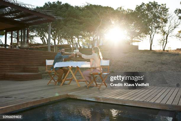 couple having private romantic dinner in luxury cabin - soft focus stock pictures, royalty-free photos & images