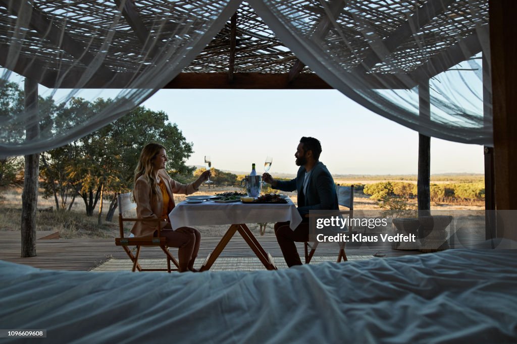 Couple having private romantic dinner in luxury cabin