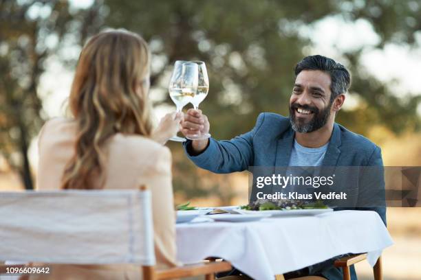 couple having private romantic dinner in luxury cabin - al fresco dining stock pictures, royalty-free photos & images