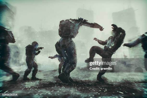 futuristic robot fight against humans - fighting robots stock pictures, royalty-free photos & images