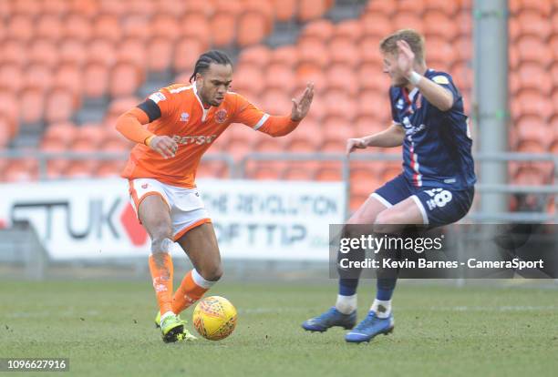 Blackpool's Nathan Delfouneso under pressure from Walsall's Kane Wilson during the Sky Bet League One match between Blackpool and Walsall at...