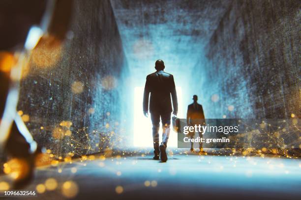 abstract futuristic businessmen walking - light at the end of the tunnel stock pictures, royalty-free photos & images