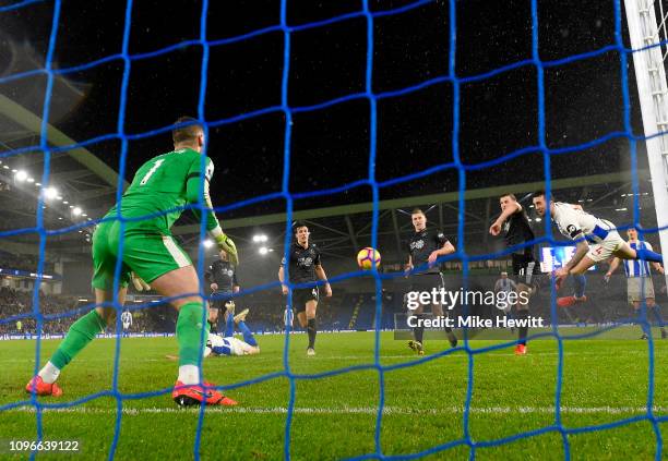 Shane Duffy of Brighton and Hove Albion scores his team's first goal past Thomas Heaton of Burnley during the Premier League match between Brighton &...