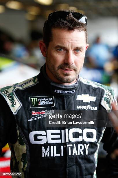 Casey Mears, driver of the Chevrolet, stands in the garage area during practice for the Monster Energy NASCAR Cup Series 61st Annual Daytona 500 at...