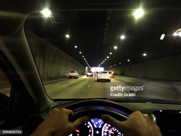 driver's point of view inside the tunnel. - point of view driving stock-fotos und bilder