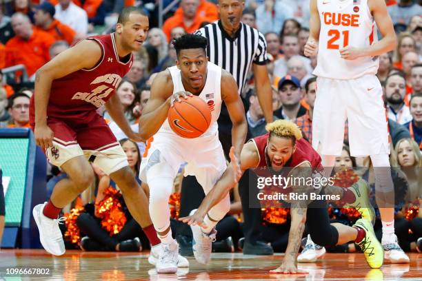 Ky Bowman of the Boston College Eagles dives for the ball controlled by Tyus Battle of the Syracuse Orange during the second half at the Carrier Dome...