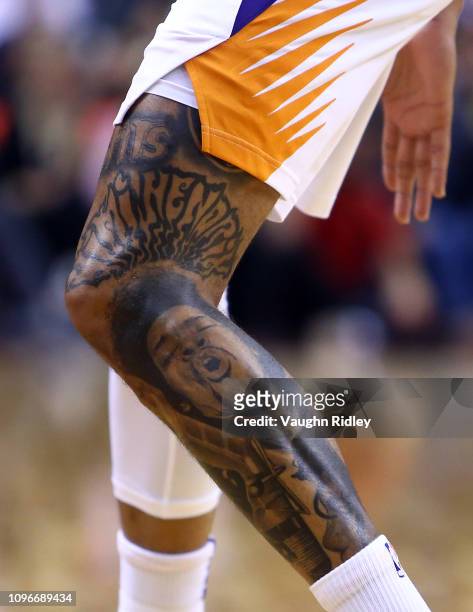 The Jimi Hendrix tattoo on the left leg of Kelly Oubre Jr. #3 of the Phoenix Suns during the second half of an NBA game against the Toronto Raptors...