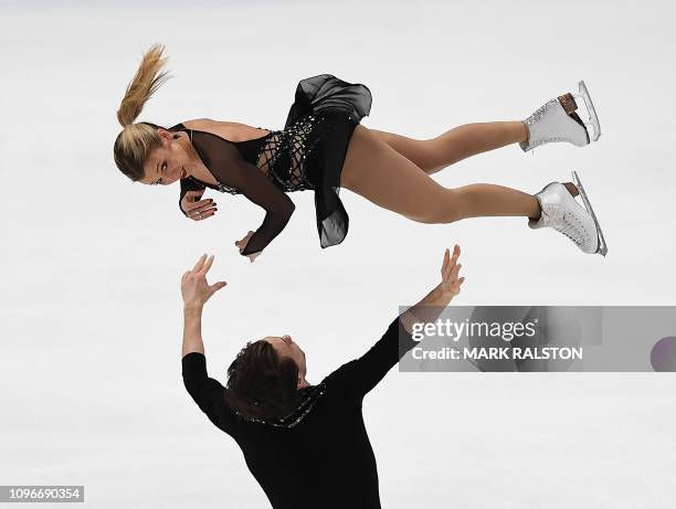 Kirsten Moore-Towers and her partner Michael Marinaro of Canada compete before finishing second in the Pairs competition during the ISU Four...