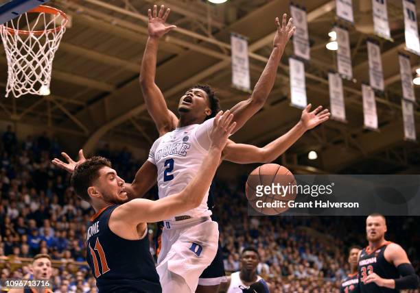 Ty Jerome of the Virginia Cavaliers fouls Cam Reddish of the Duke Blue Devils during the second half of their game at Cameron Indoor Stadium on...