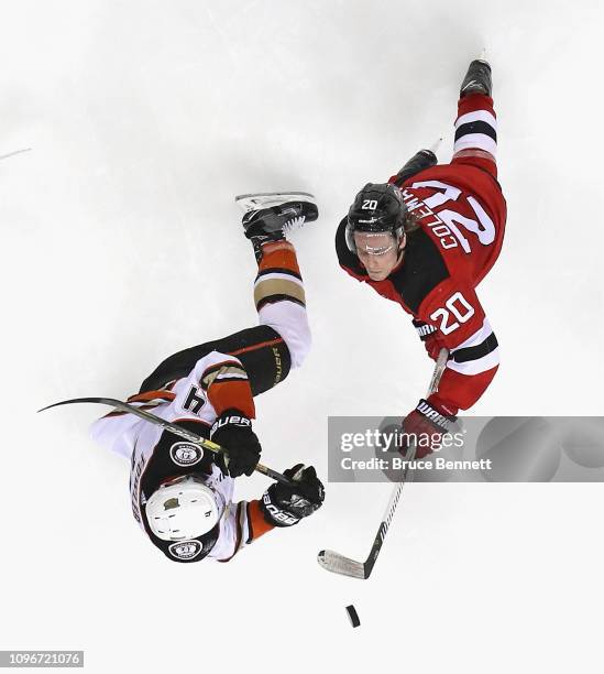 Blake Coleman of the New Jersey Devils skates against Cam Fowler of the Anaheim Ducks at the Prudential Center on January 19, 2019 in Newark, New...