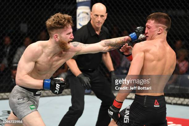 Austin Arnett punches Shane Young of New Zealand in their featherweight bout during the UFC 234 at Rod Laver Arena on February 10, 2019 in the...