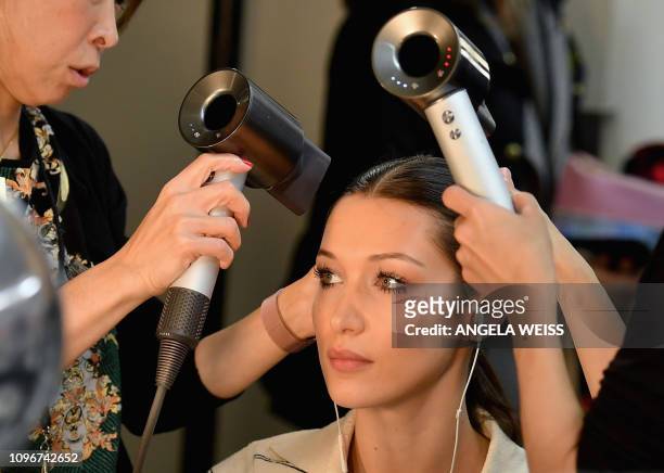 Model Bella Hadid gets her hair done backstage ahead of the Brandon Maxwell fashion show during New York Fashion Week: The Shows at Penn Plaza...