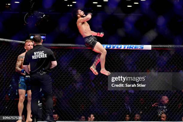 Henry Cejudo reacts after defeating TJ Dillashaw in the first round during their UFC Flyweight title match at UFC Fight Night at Barclays Center on...