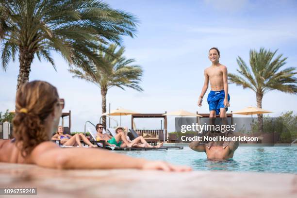 family fun in the pool - lido stock pictures, royalty-free photos & images