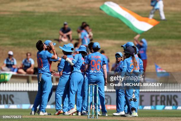 India celebrate after taking the wicket of New Zealand's Suzie Bates during the third Twenty20 international women's cricket match between New...