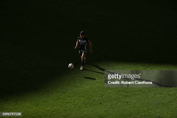 Terry Antonis of the Victory runs with the ball during the round 14 A-League match between the Melbourne Victory and the Wellington Phoenix at AAMI...