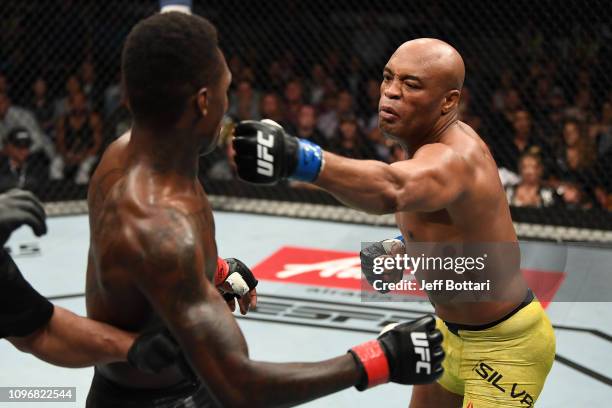 Anderson Silva of Brazil punches Israel Adesanya of New Zealand in their middleweight bout during the UFC 234 at Rod Laver Arena on February 10, 2019...