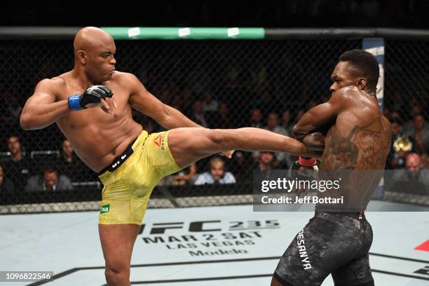 Anderson Silva of Brazil kicks Israel Adesanya of New Zealand in their middleweight bout during the UFC 234 at Rod Laver Arena on February 10, 2019...