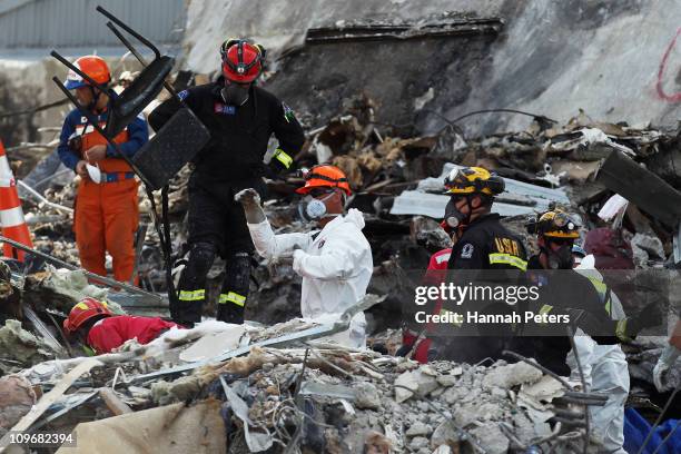 Rescue workers clear out remains from the CTV building on March 1, 2011 in Christchurch, New Zealand. The death toll from the earthquake has risen to...