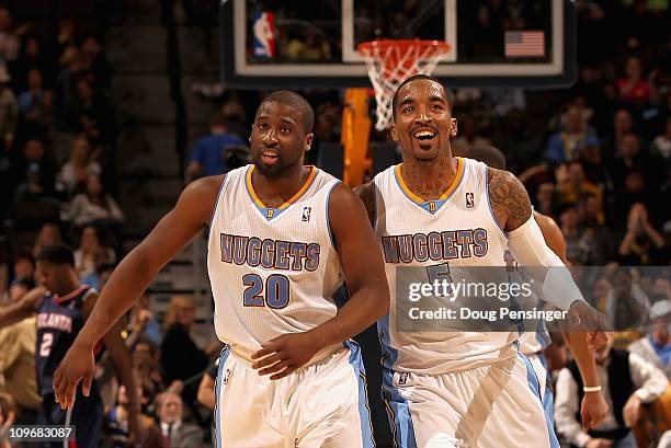 Raymond Felton and J.R. Smith of the Denver Nuggets celebrate after connecting to score against the Atlanta Hawks during NBA action at the Pepsi...