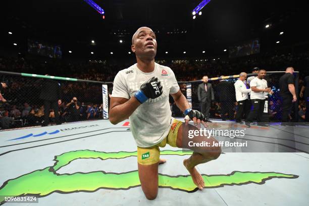 Anderson Silva of Brazil kneels at the center of the Octagon after his loss to Israel Adesanya of New Zealand in their middleweight bout during the...