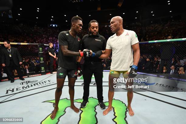 Israel Adesanya of New Zealand and Anderson Silva of Brazil touch gloves after their middleweight bout during the UFC 234 at Rod Laver Arena on...