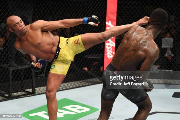 Anderson Silva of Brazil kicks Israel Adesanya of New Zealand in their middleweight bout during the UFC 234 at Rod Laver Arena on February 10, 2019...