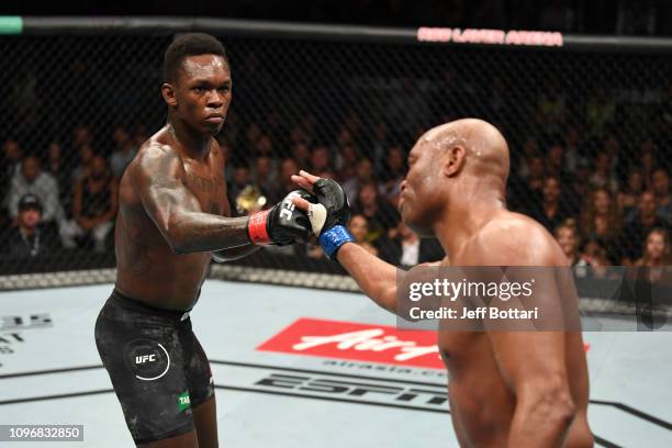 Israel Adesanya of New Zealand and Anderson Silva of Brazil touch gloves in their middleweight bout during the UFC 234 at Rod Laver Arena on February...