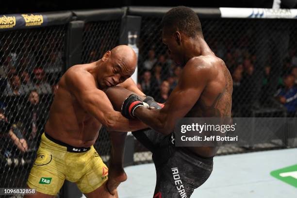 Israel Adesanya of New Zealand knees Anderson Silva of Brazil in their middleweight bout during the UFC 234 at Rod Laver Arena on February 10, 2019...