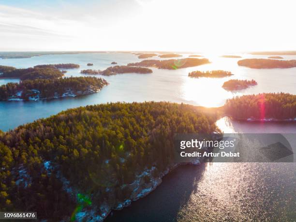 stunning aerial view of the stockholm archipelago islands with sunset light. - archipelago sweden stock pictures, royalty-free photos & images