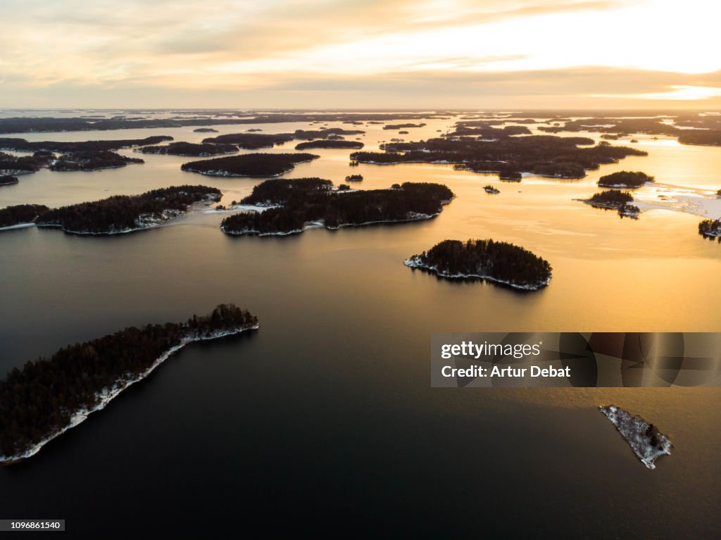 Stunning aerial view of the Stockholm archipelago islands with sunset light.