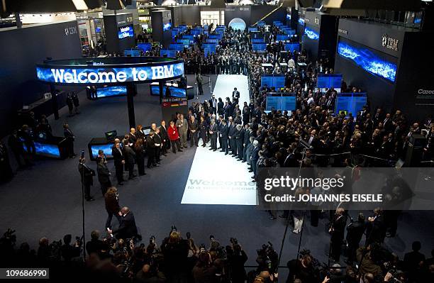 German Chancellor Angela Merkel visits the IBM stand as she tours the CeBIT IT fair on its opening day on March 1, 2011 in Hanover, central Germany....