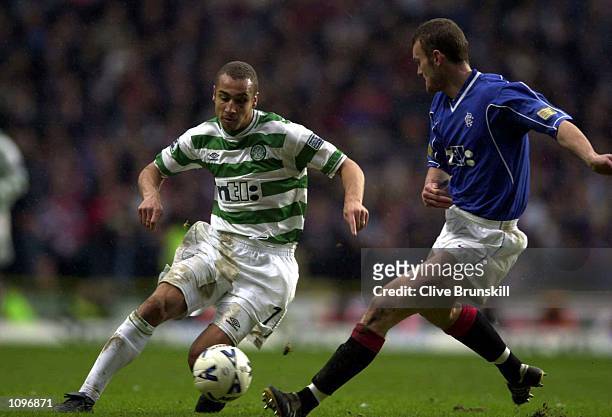 Henrik Larsson of Celtic attempts to move pastScott Wilson of Rangers during the SPL Scottish Premier League match Glasgow Celtic v Rangers at...