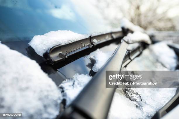 snow on windshield - winter car window stock-fotos und bilder